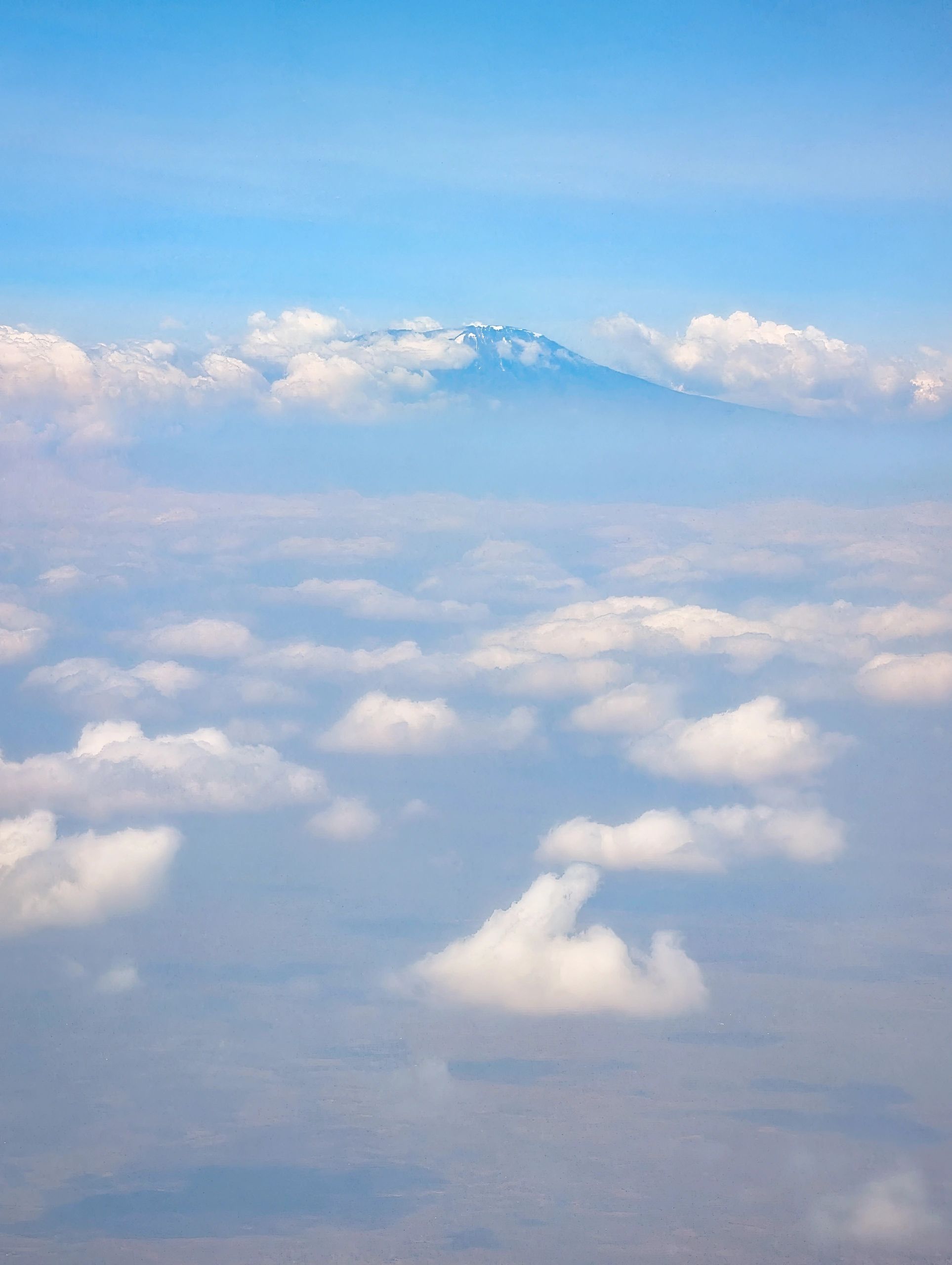 Mount Kilimanjaro summit above the clouds at dawn